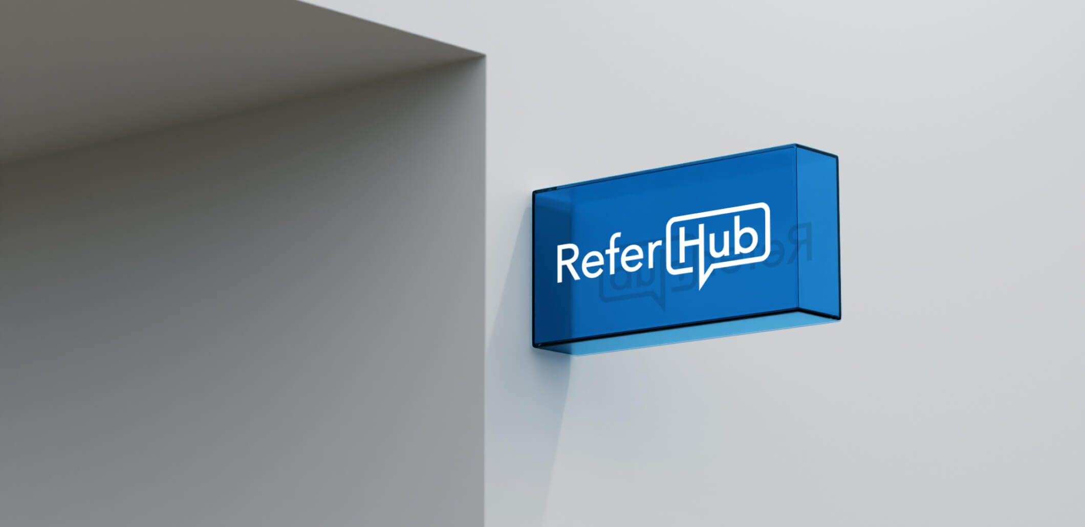 ReferHub branded sign on a blue glass panel.